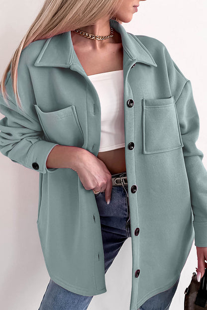 Veste-chemise boutonnée à manches longues et poches de couleur unie noire 