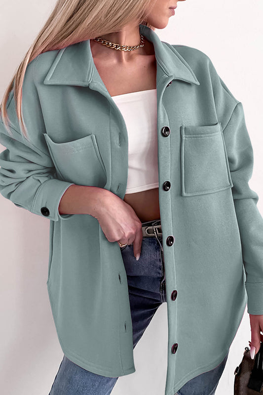 Chaqueta de manga larga con botones y bolsillos de color liso negro 