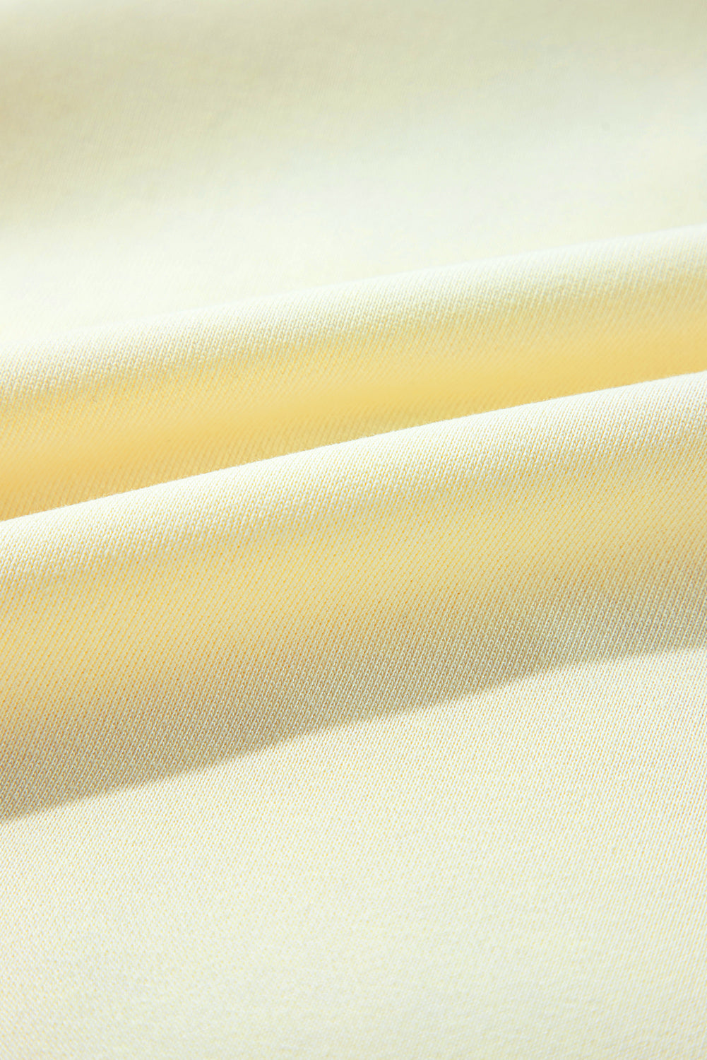 Sweat-shirt beige à manches bouffantes et fleurs en guirlandes