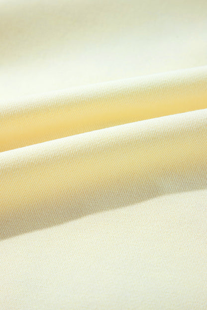 Sweat-shirt beige à manches bouffantes et fleurs en guirlandes