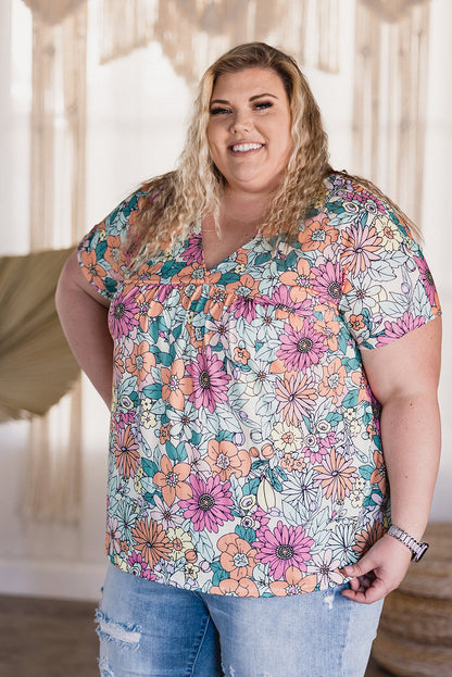 Top de manga corta con dobladillo asimétrico y estampado floral multicolor 