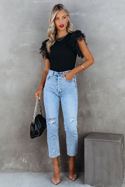 Haut en maille côtelée à volants et manches en maille à pois