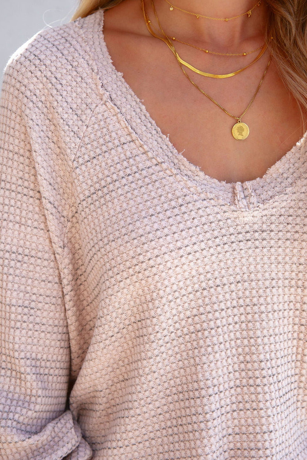 Haut effiloché à manches longues et col en V en tricot gaufré rose 