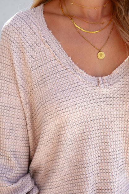 Haut effiloché à manches longues et col en V en tricot gaufré rose 