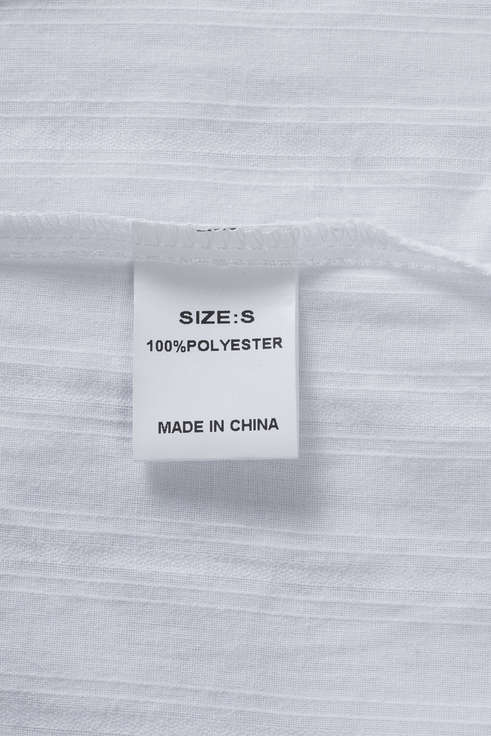 Camisa con botones texturizados y bolsillos