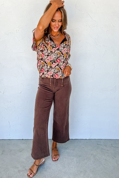 Chemisier rose à imprimé floral et ourlet boule à col fendu