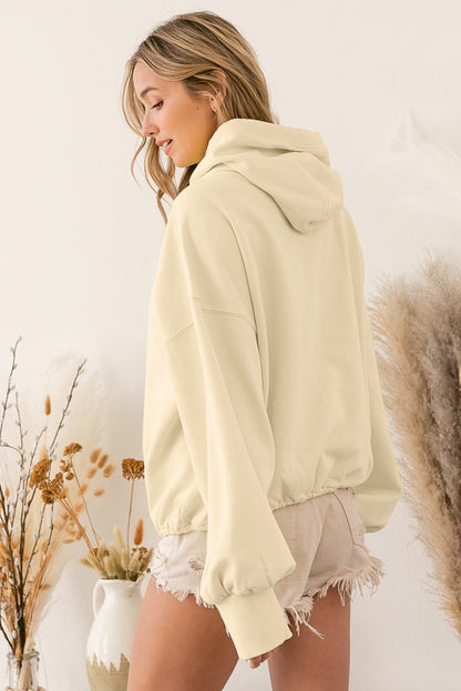 Sweat à capuche zippé beige à bordure côtelée et poche kangourou 