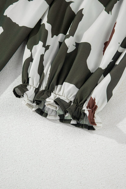 Chemisier à manches bouffantes et demi-bouton à imprimé floral abstrait trèfle à quatre feuilles