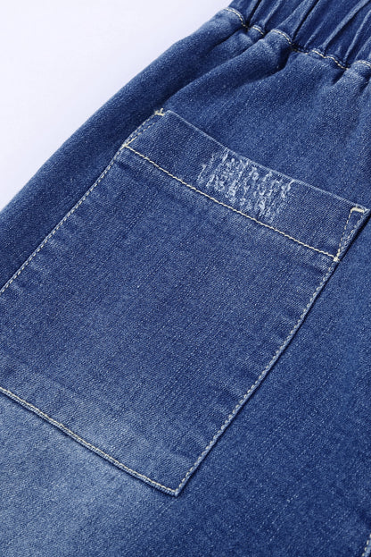 Joggers de mezclilla desgastados con bolsillos