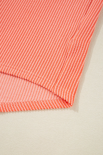 Chemise ample à manches mi-longues et ourlet haut-bas boutonné, couleur pamplemousse orange