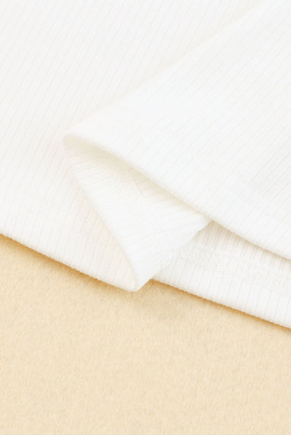 Haut en maille côtelée à volants et manches en maille à pois