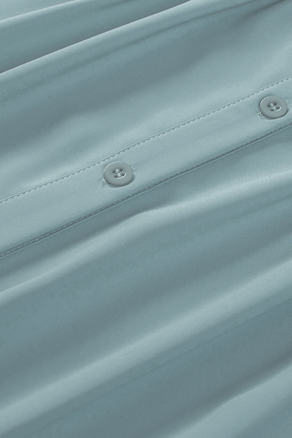 Chemisier boutonné à manches bouffantes de couleur unie