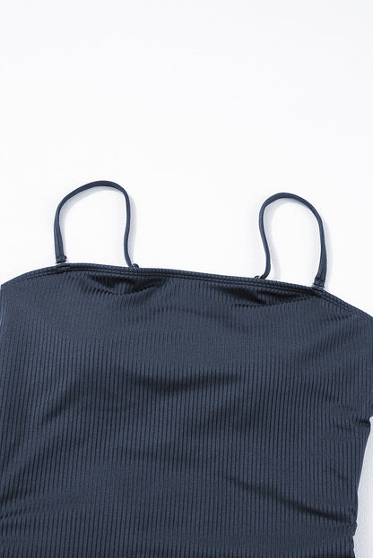 Maillot de bain une pièce bleu marine côtelé avec cordon de serrage et découpes sur les côtés