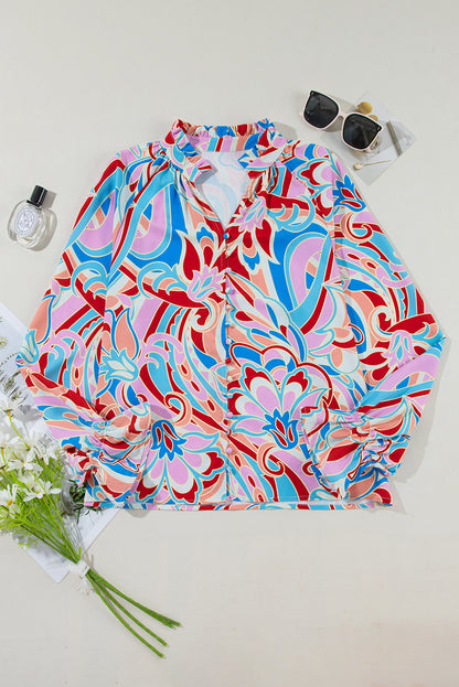 Chemisier rose à imprimé abstrait, col à volants et manches à volants