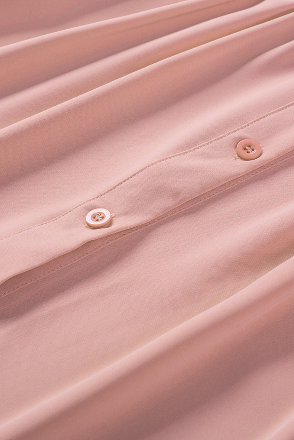 Chemisier boutonné à manches bouffantes de couleur unie