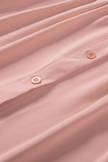 Chemisier boutonné à manches bouffantes de couleur unie