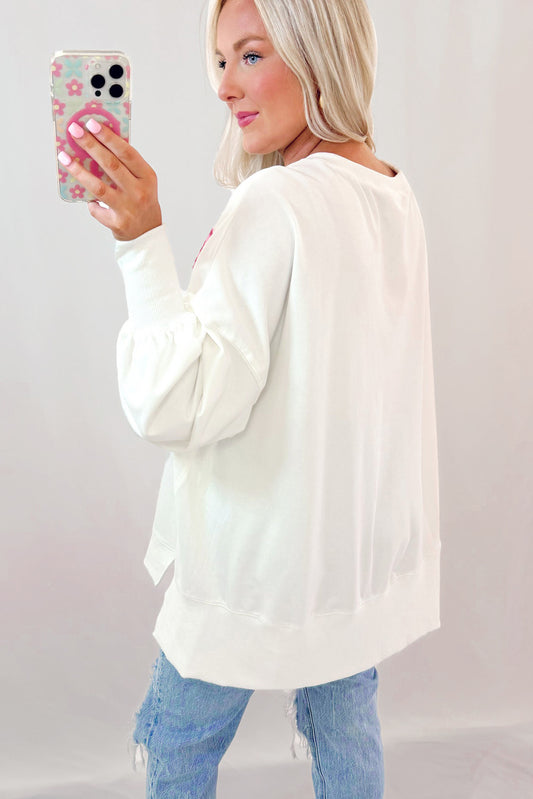 Sweat-shirt oversize blanc à paillettes et nœud papillon