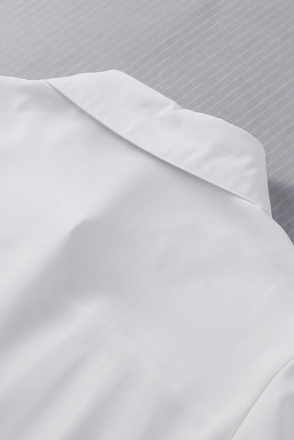 Chemisier boutonné à manches bouffantes de couleur unie