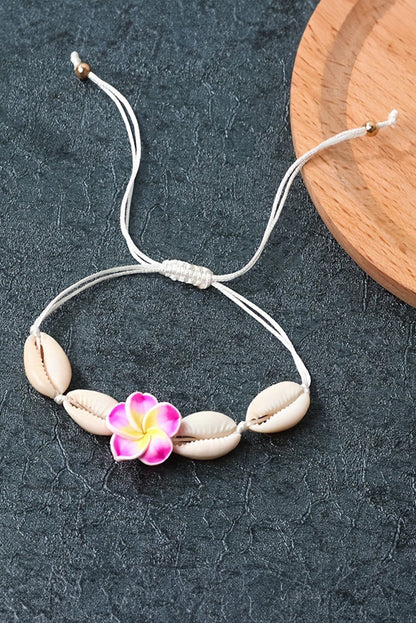 Bracelet ajustable en coquillage et fleur blanche