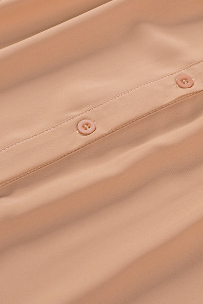 Chemisier boutonné à manches bouffantes de couleur unie