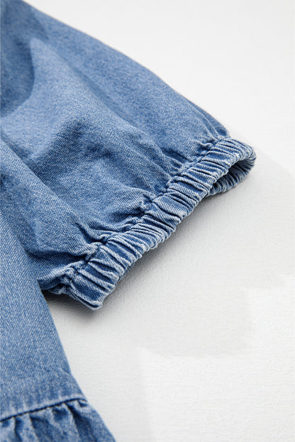 Chemise en jean péplum bleu crépuscule à manches bouffantes et nouée sur le devant