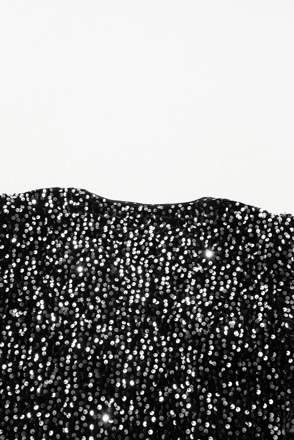 Veste courte ouverte à paillettes noires