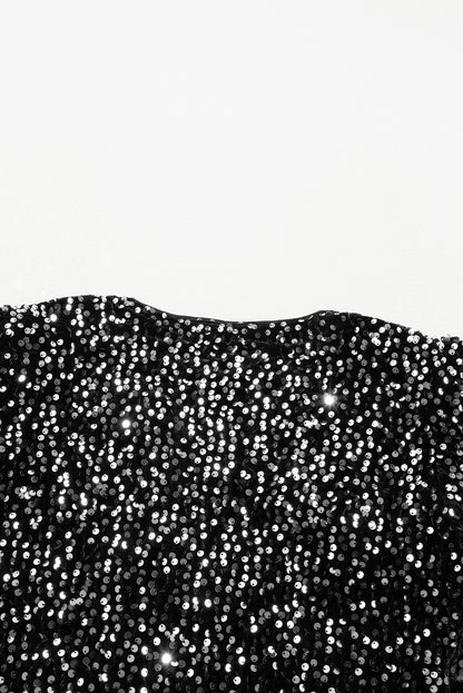 Veste courte ouverte à paillettes noires