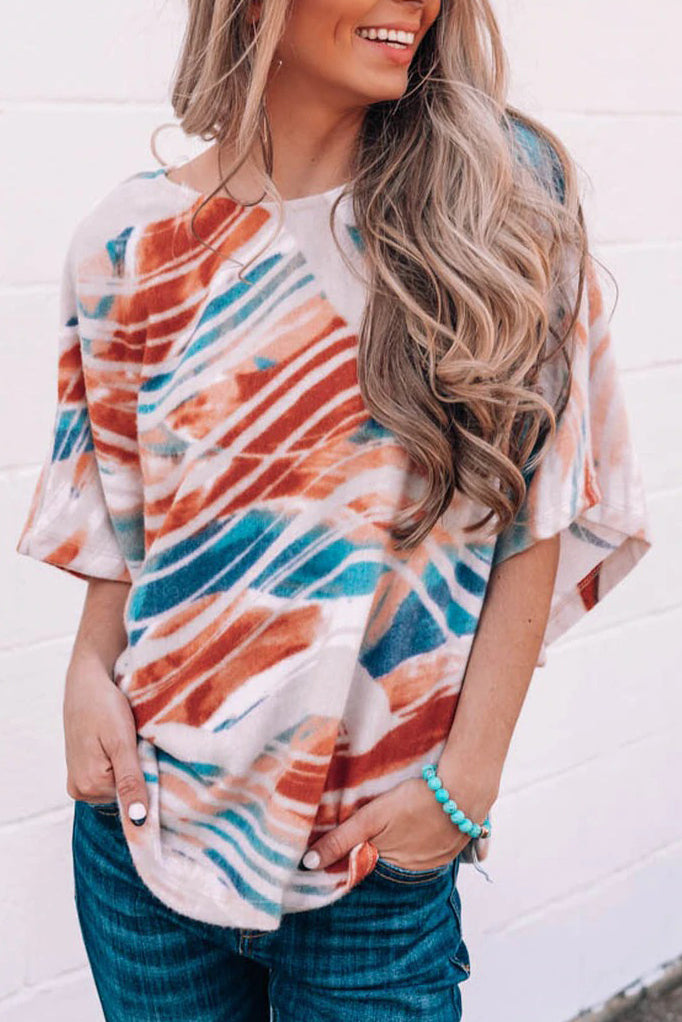 Top dolman fluido con estampado tie-dye