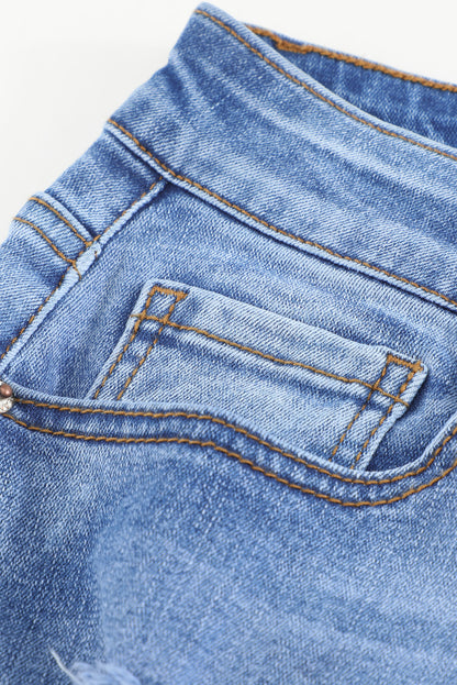 Jeans ajustados al tobillo desgastados con lavado medio