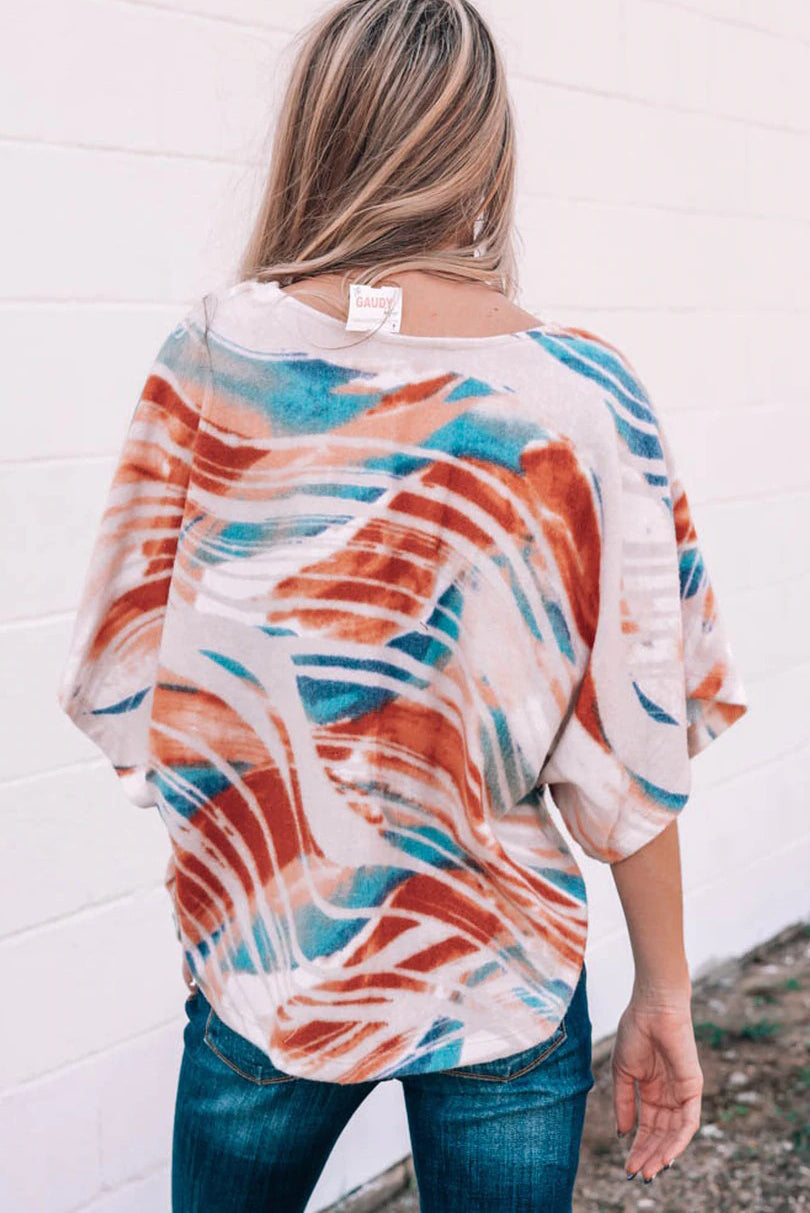 Top dolman fluido con estampado tie-dye