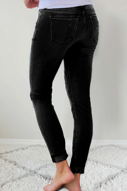 Jeans ajustados de cintura alta con bolsillo de parche de leopardo rasgado