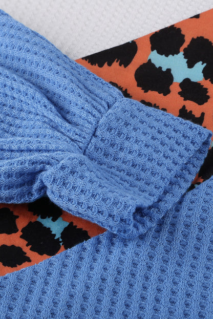 Top de punto con patchwork de leopardo colorblock