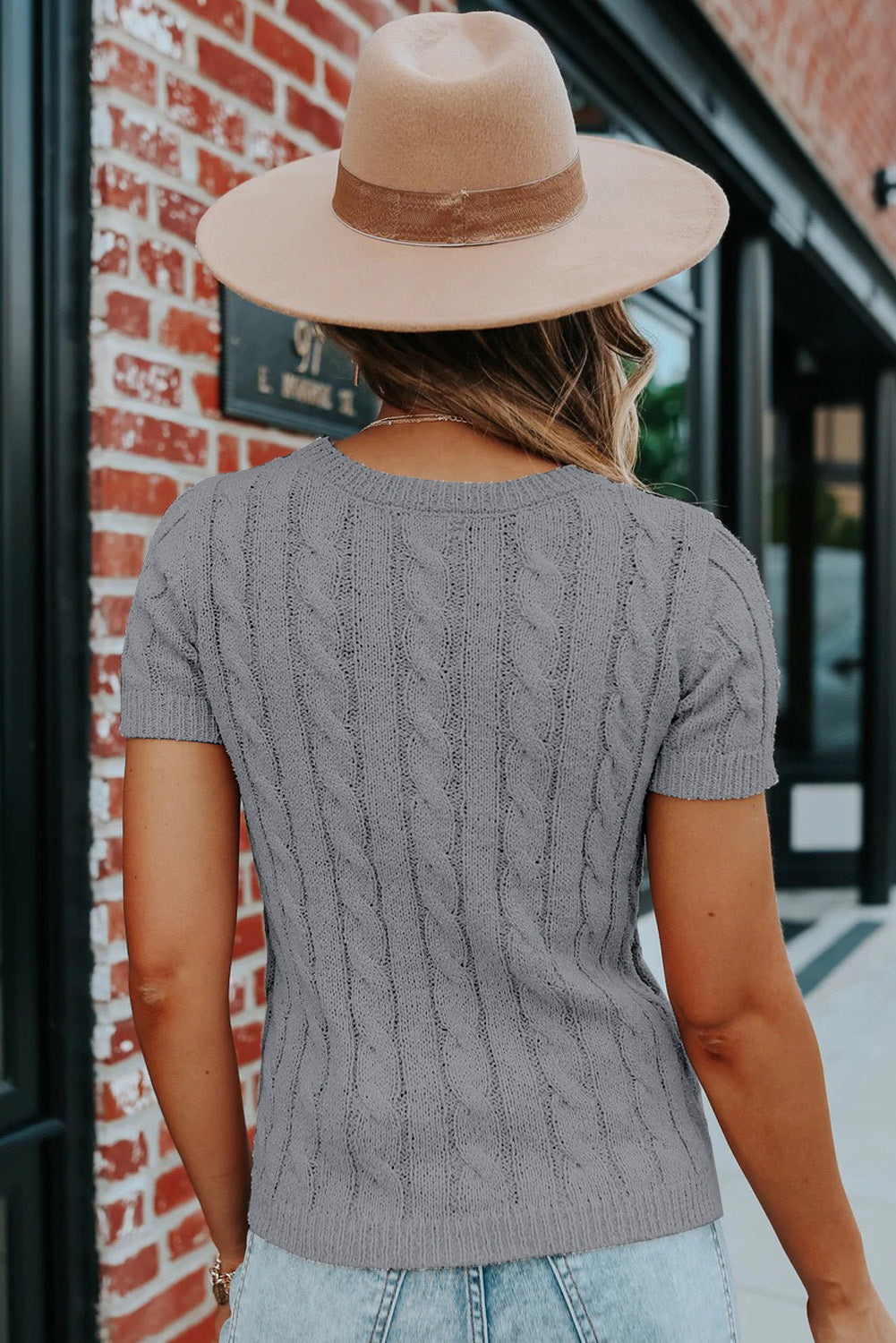 Top caqui de punto de ochos con botones y manga corta