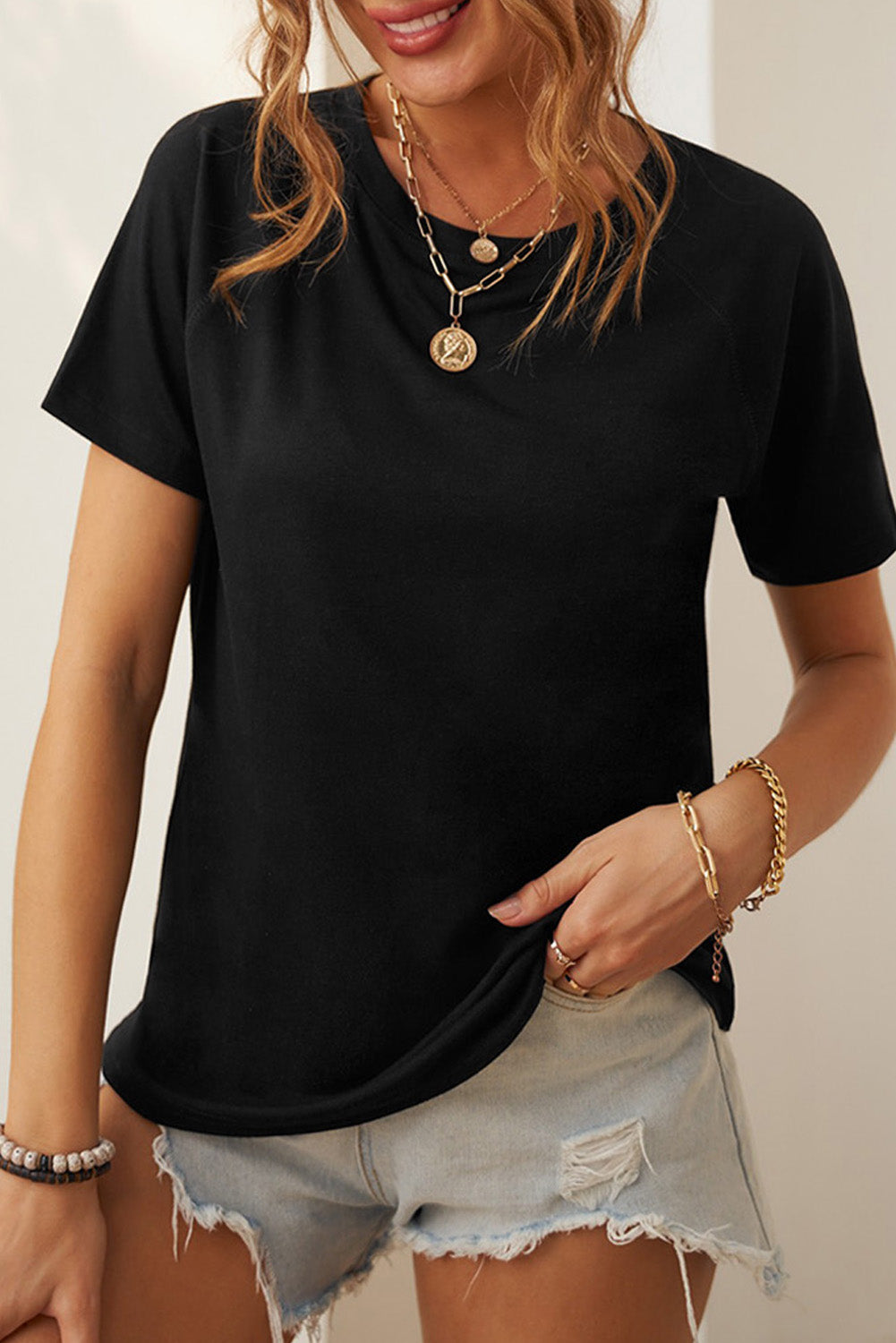 Camiseta con cuello redondo y manga raglán