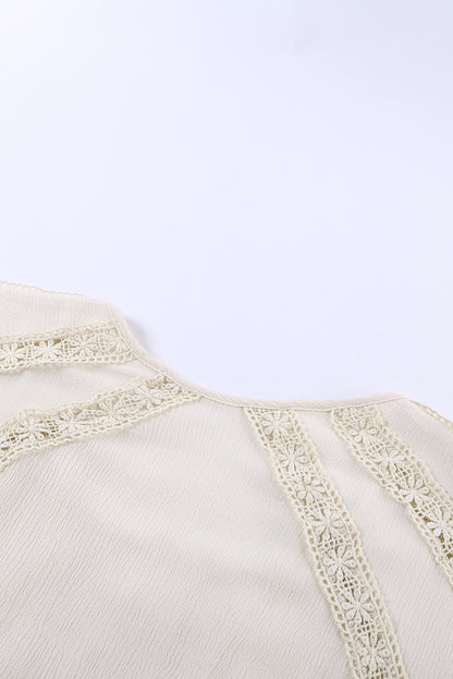 Top de manga corta con ojales de ganchillo