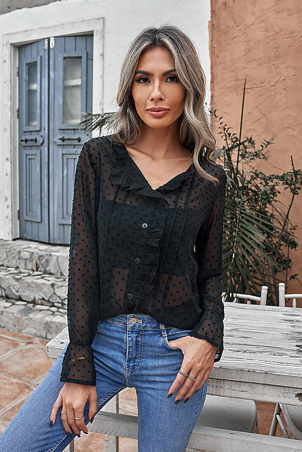 Camisa abotonada con volantes y lunares