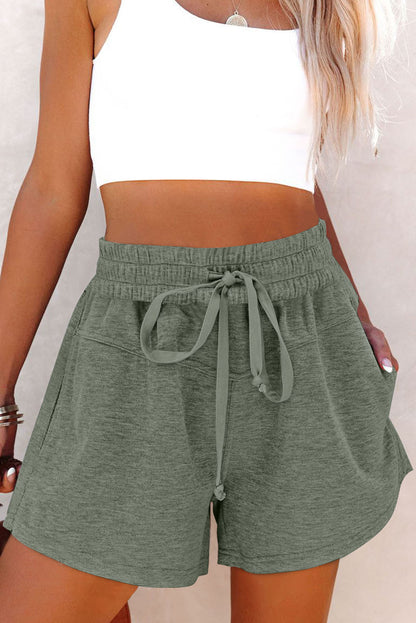 Pantalones cortos de punto con cordón elástico en la cintura y bolsillos laterales