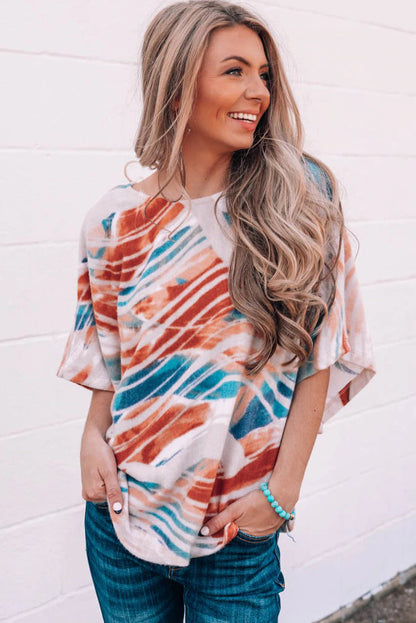 Top dolman fluido con estampado tie-dye