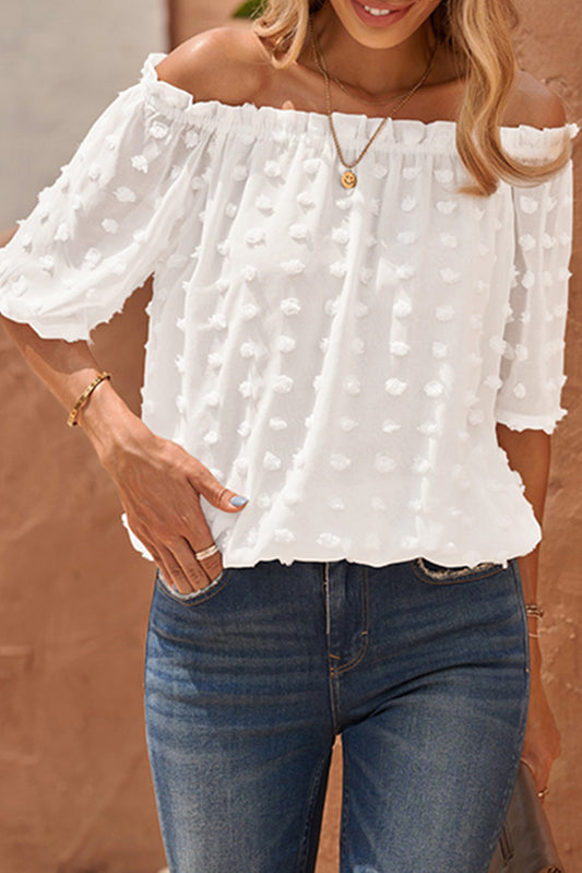 Blusa corta con hombros descubiertos y lunares suizos