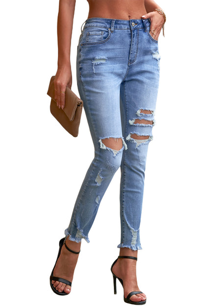 Jeans ajustados al tobillo desgastados con lavado medio