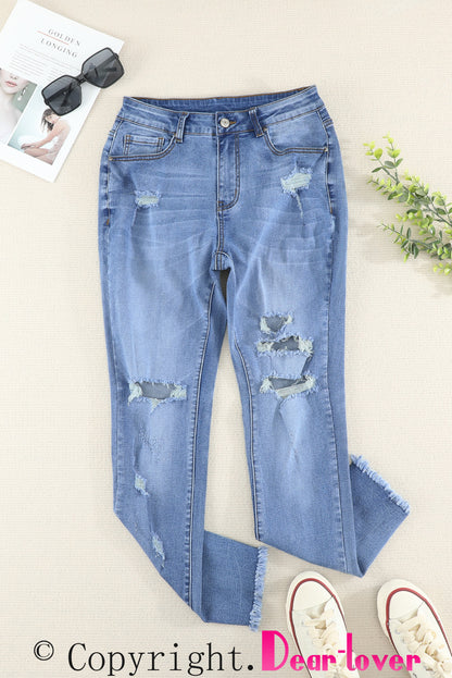 Jeans ajustados al tobillo desgastados con lavado medio