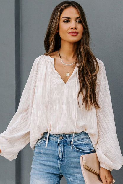 Haut uni texturé à col en V et manches lanternes 