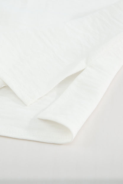 Top de manga corta con ojales de ganchillo