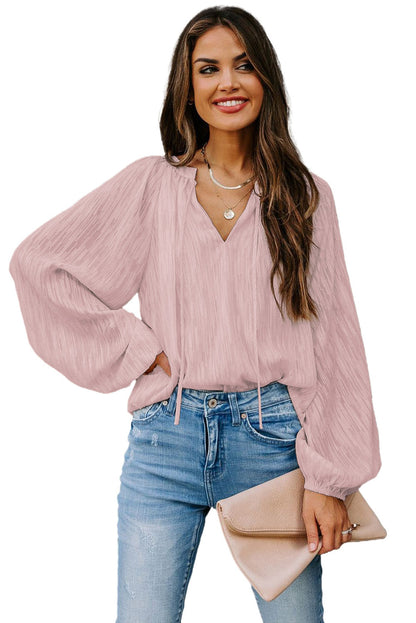 Haut uni texturé à col en V et manches lanternes 