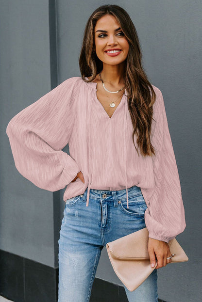 Haut uni texturé à col en V et manches lanternes 