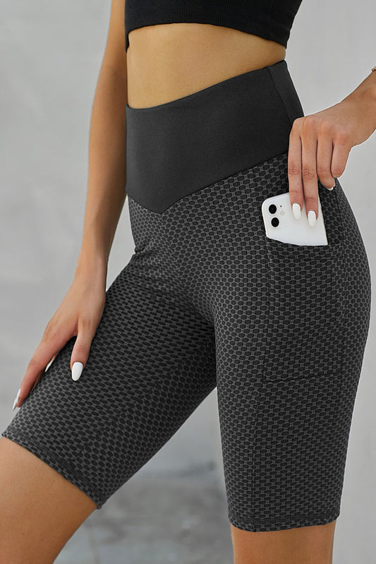 Shorts de yoga con bolsillos laterales fruncidos para levantamiento de glúteos