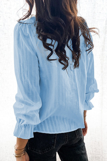 Camisa con volantes y mangas abullonadas