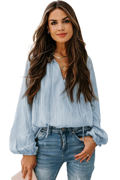 Haut uni texturé à col en V et manches lanternes 