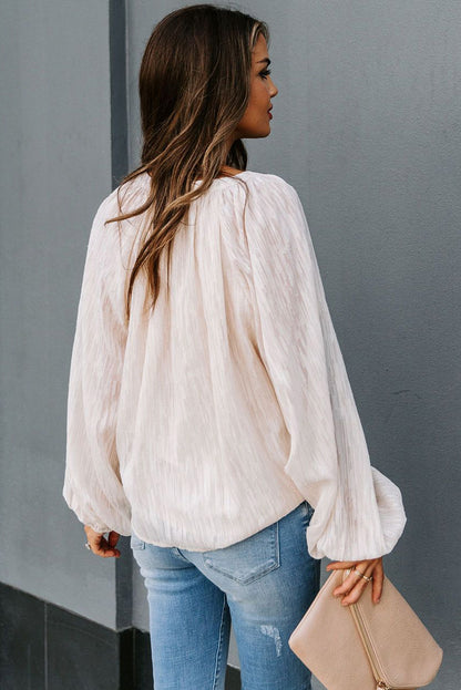 Haut uni texturé à col en V et manches lanternes 