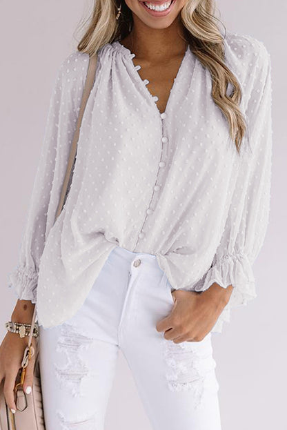 Chemise à pois suisses à boutons amples 